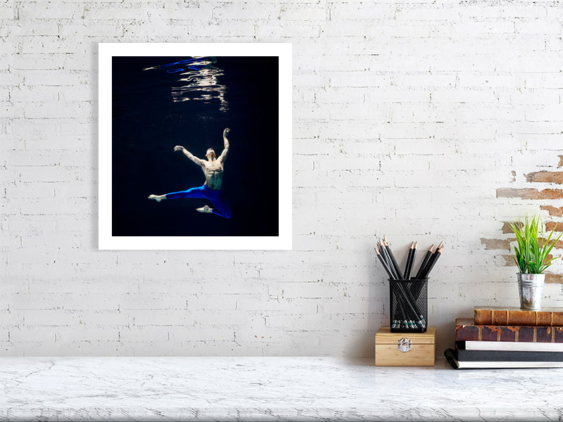 Unframed fine art print of "Gravity in Motion", showcasing suspended movement underwater and dramatic composition on archival paper.