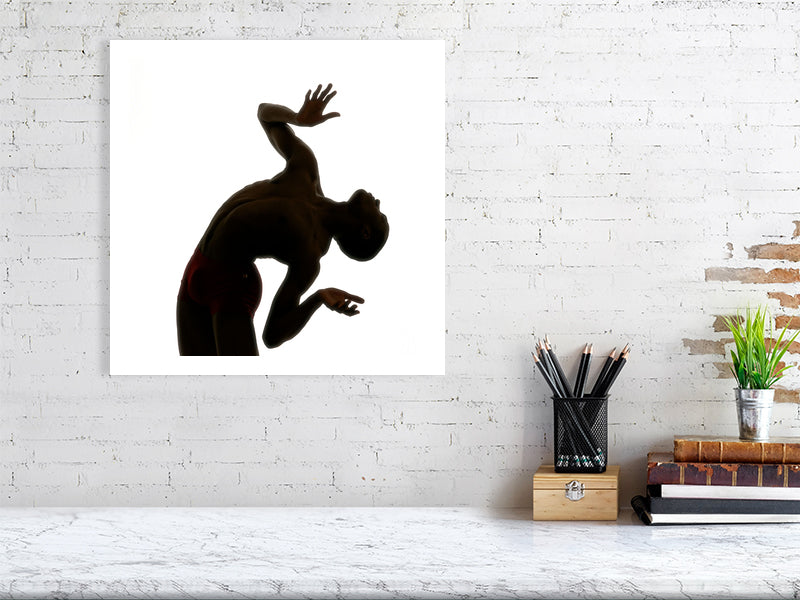 Unframed fine art print of "Male Dancer Silhouette", a high-contrast monochrome study of dance motion. Printed on museum-grade Hahnemühle Photo Rag.