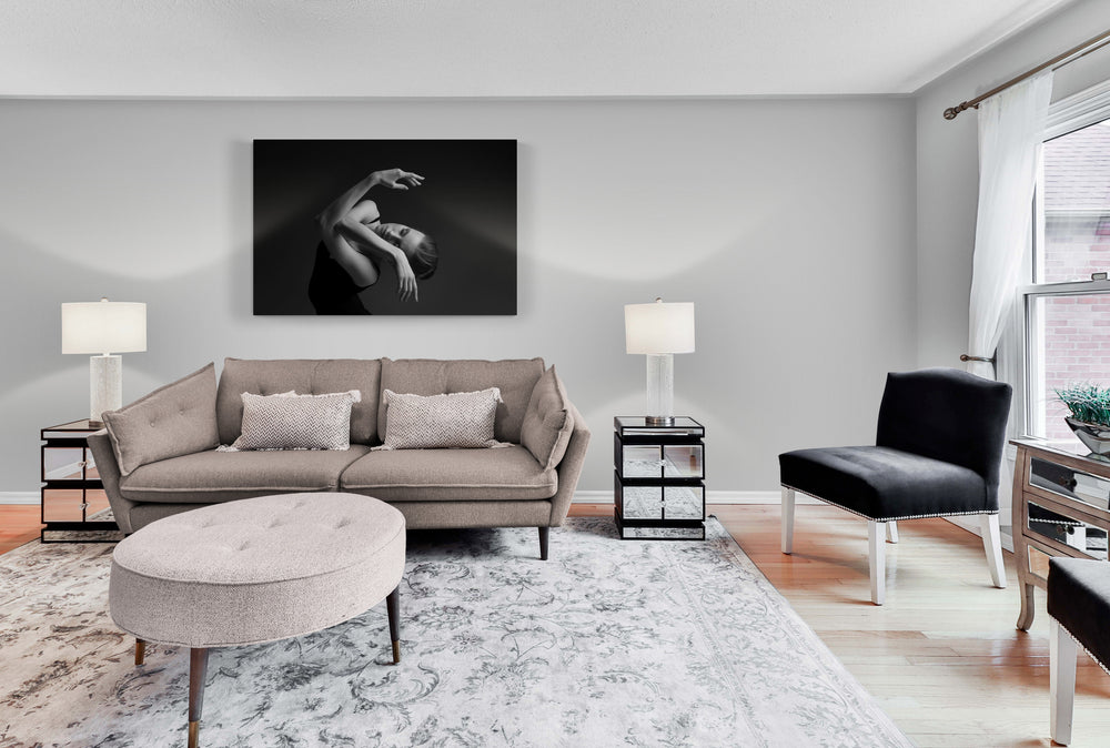 Dancer, female, portrait, close-up. Intertwined hands, in front of the face, eyes closed. head is on the side. she is dancing. Art on the living room wall.