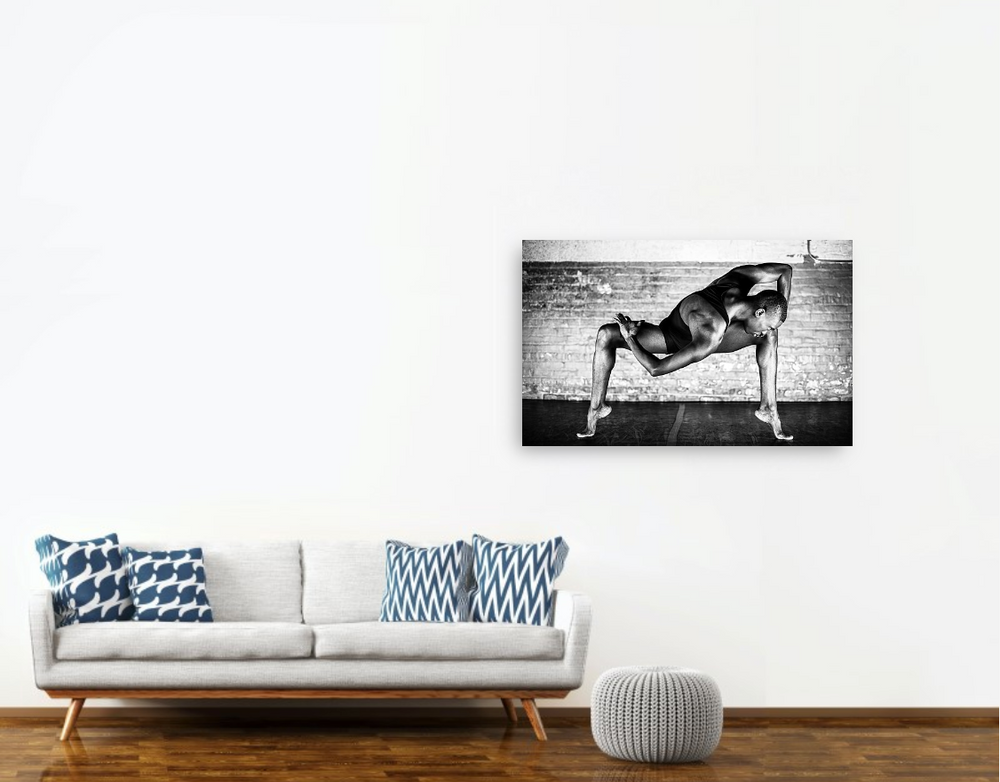 Black and white photo of a male dancer performing a graceful