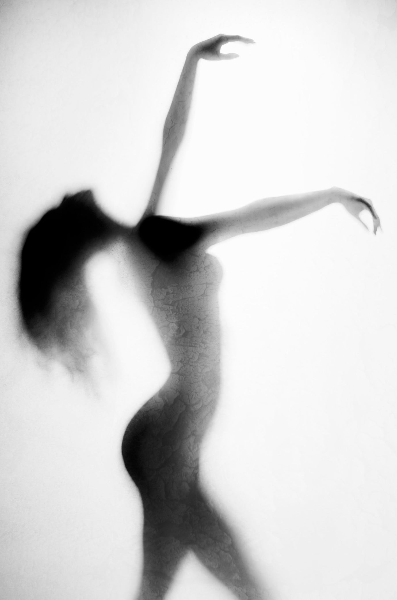 Fine art dance photography of a silhouetted figure emerging from a warm-white background, embodying the serene Cloud Dancer 11-4201 aesthetic for contemporary interior design.