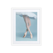 Delicate Rise dance framed poster from the Fine Art Dance Framed Posters Collection, featuring a ballerina's graceful pointe pose in a classic white frame, perfect for elegant home decor or as a meaningful gift.