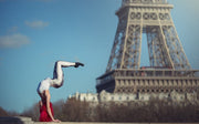 Dimitry Roulland's Tour Eiffel Dance Art Print featuring a dancer performing a dynamic handstand with the Eiffel Tower in the background. Archival pigment print available at Dance Artworks Gallery.