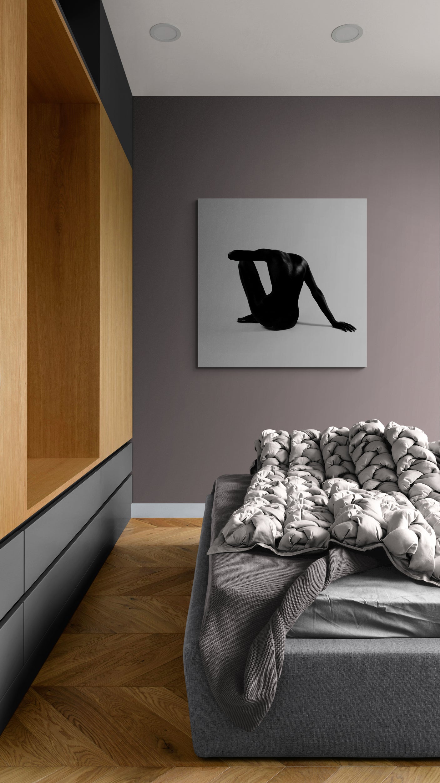 Modern interior with a gray sofa, wooden shelf, and abstract art on the wall.