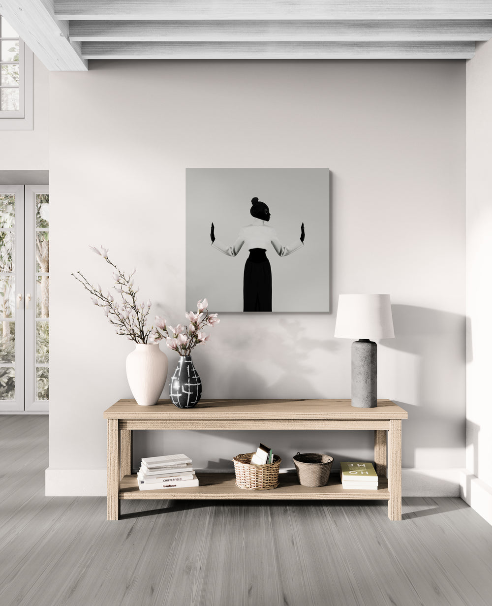 Front-facing figure with raised hands, axis steady; museum-quality print displayed on wall for modern minimalist decor and design-led projects.