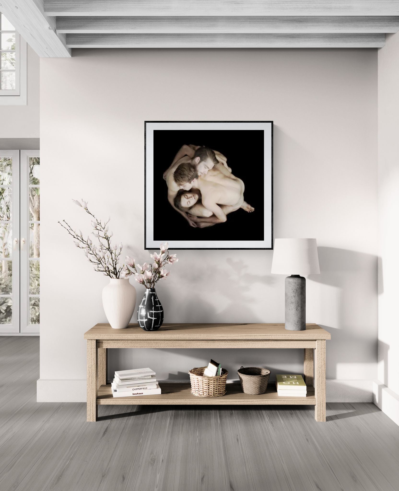Mock-up showing the HEWMAN Collective limited edition fine art print by Nir Arieli displayed in a modern interior. The dancers appear in a sculptural group formation photographed on a dark background.