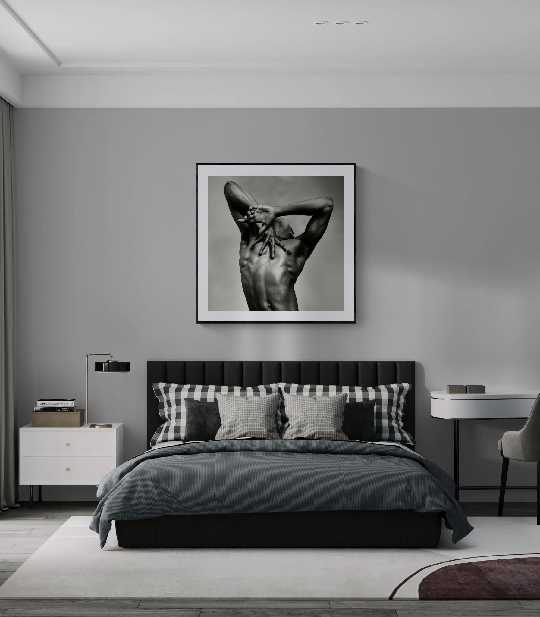 Framed J. by Sasha Onyshchenko fine art print displayed above a dark grey bed in a contemporary bedroom with minimalist interior design.