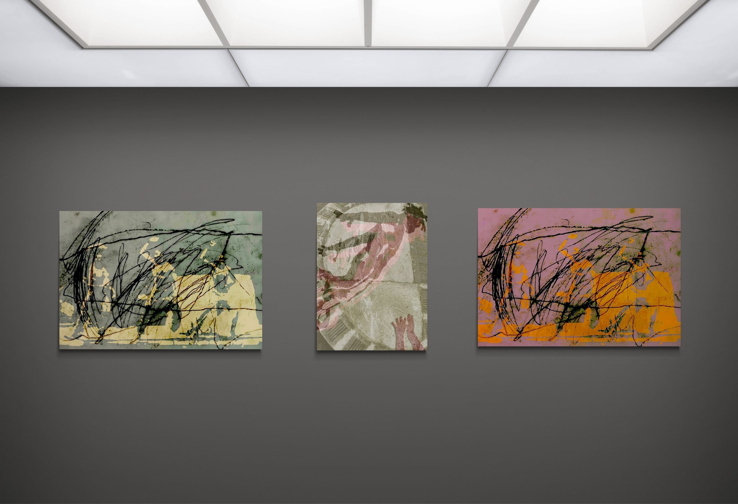 Triptych of Marc Feld’s “CIRCUS” series - layered pigment prints merging choreography, paint, and digital textures (Baobab Circus), curated by Dance Artworks Gallery, Barcelona. The image showing three abstract paintings on a gray wall with ceiling lights above.