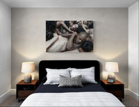 Bedroom wall with Nir Arieli Cedar Lake Contemporary Ballet archival pigment print 120×80 cm above bed, side tables with lamps.