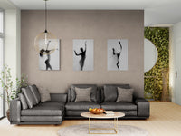 Lifestyle view showing three black-and-white dance photographs by Cédric Brion installed above a grey sofa (premium fine art wall art for contemporary interiors).
