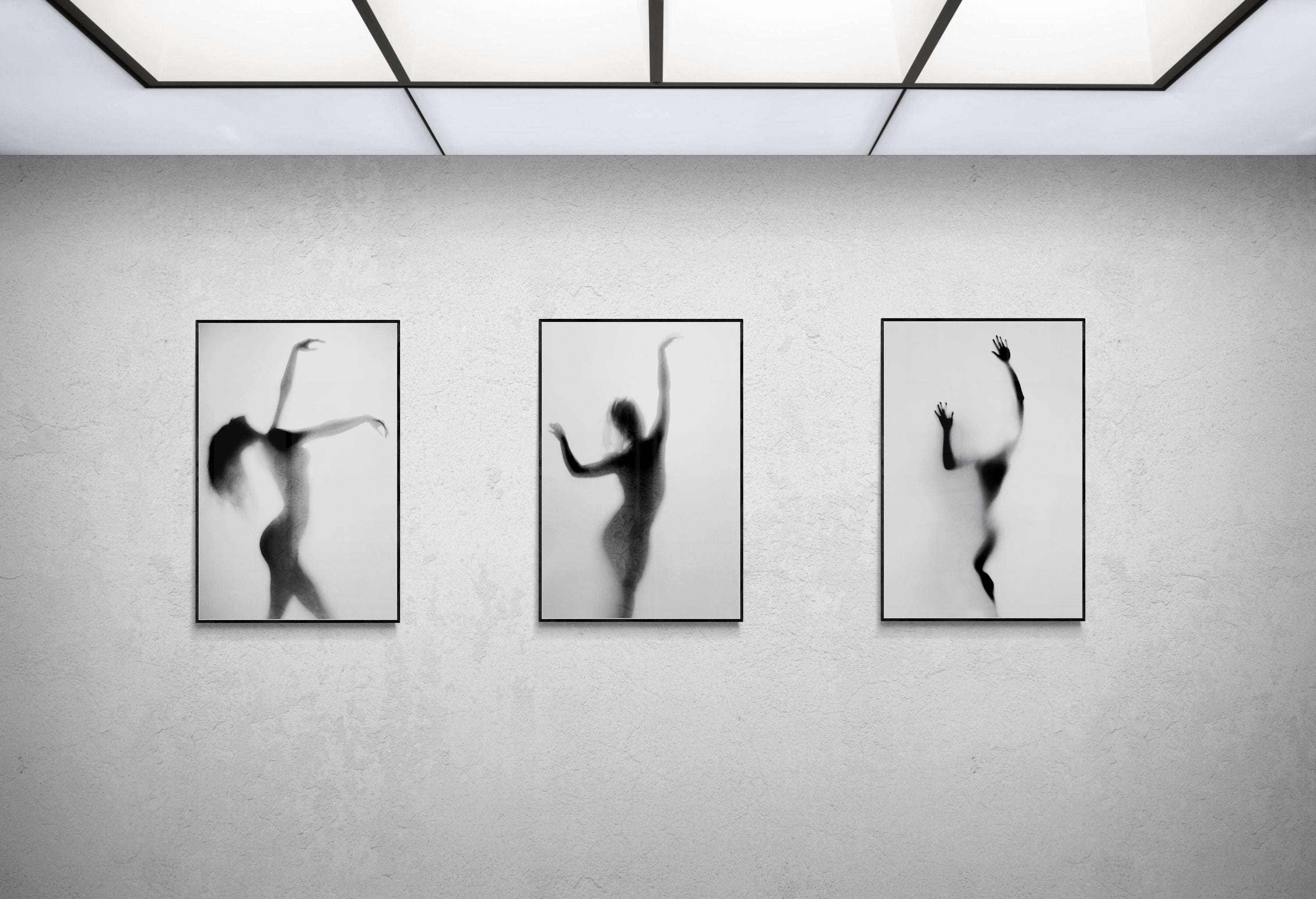Triptych of black-and-white dance silhouettes by Cédric Brion mounted on aluminium Dibond in Black tray frames, resented on a gallery wall art exhibition.