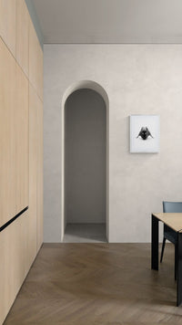 Framed fine art dance nude photograph “Tensile Verse #43G” on a minimalist wall beside an arched doorway.