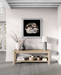 Mock-up showing The People Movers limited edition fine art print by Nir Arieli displayed in a modern minimalist interior. The dancers form a sculptural circular composition photographed in studio lighting.