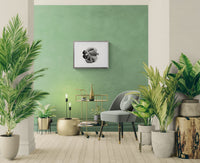 Modern living room with green walls, plants, and a gray sofa.