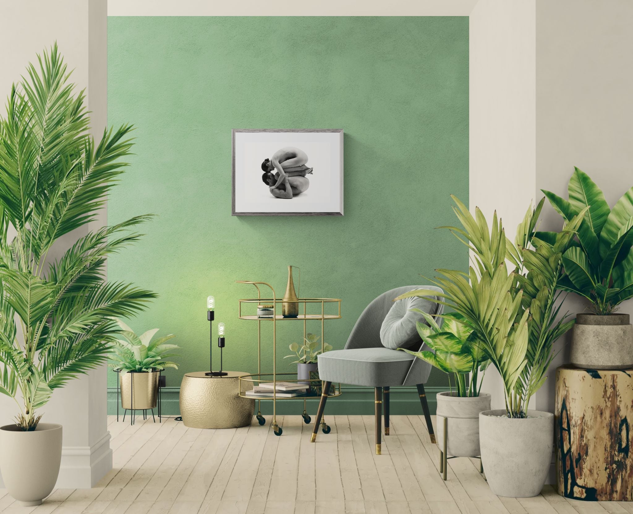 Modern living room with green walls, plants, and a gray sofa.