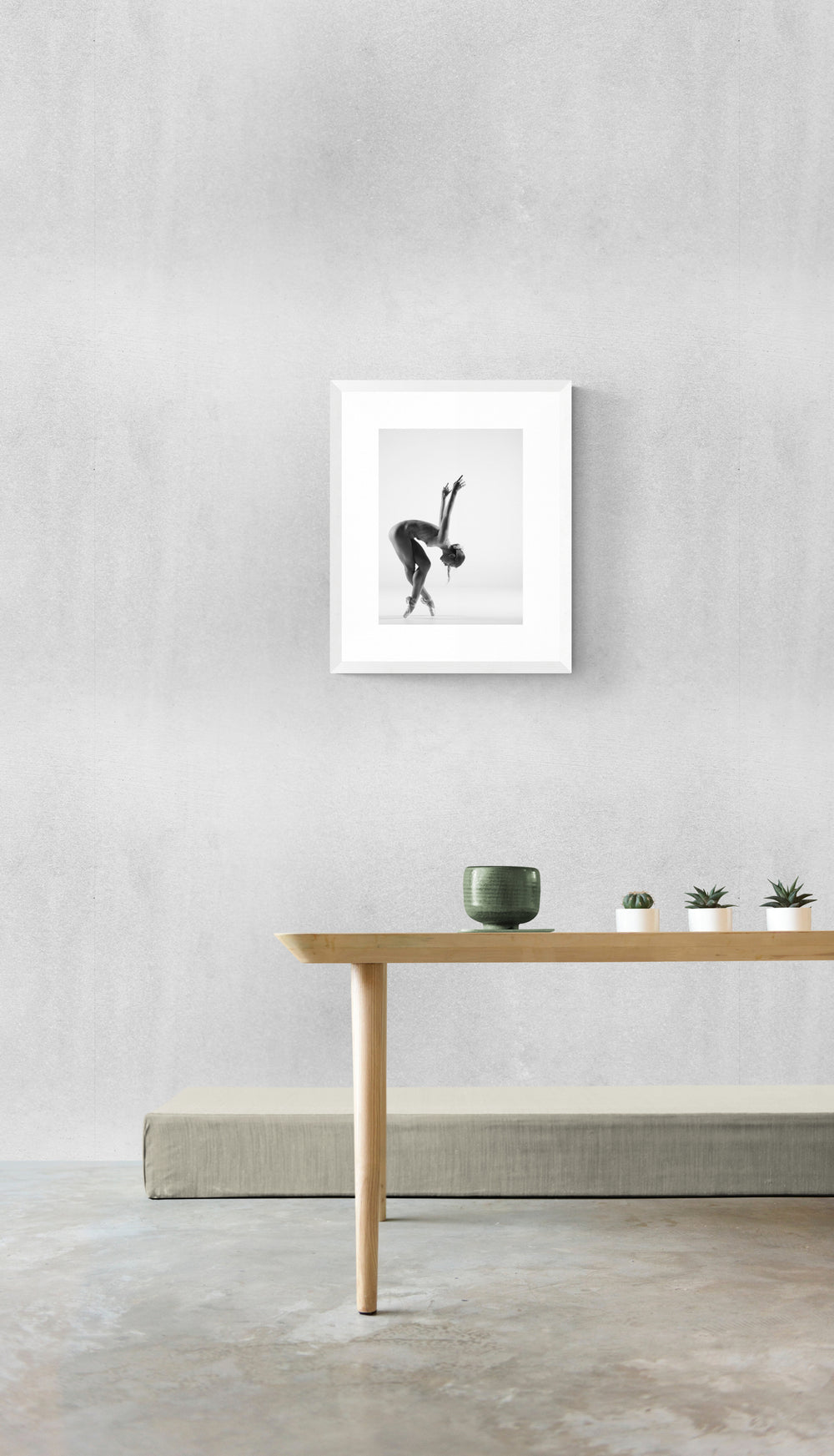 Mockup of Anna #21 fine art dance print by E.E. McCollum, displayed in a modern minimalist interior with a white frame, highlighting its elegance and versatility for contemporary home decor.