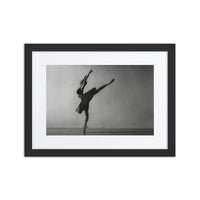 Arabesque Reach – A captivating black-and-white photograph of a ballerina in an elegant arabesque pose, captured in perfect balance and framed for a timeless gallery-style display.