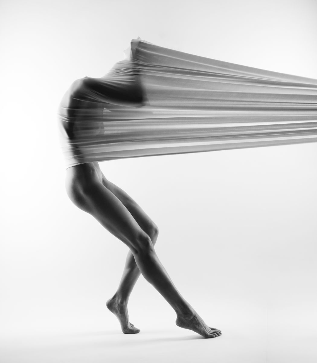 Arkadiusz Branicki's Fine Art Dance Photography Print featuring a dancer entwined in flowing fabric, highlighting grace and motion.