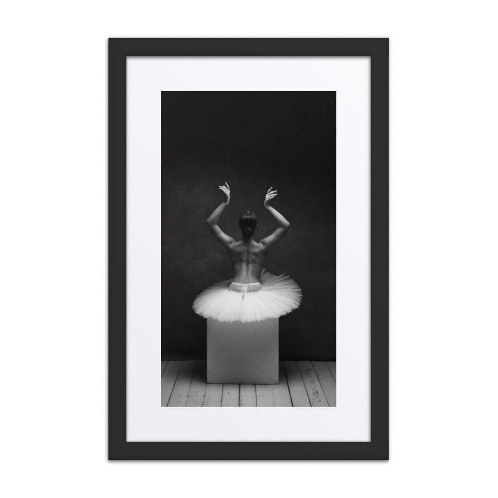 A captivating black-and-white image portraying a ballerina on a textured platform, her delicate tutu and raised arms illustrating a perfect blend of solitude and artistry.