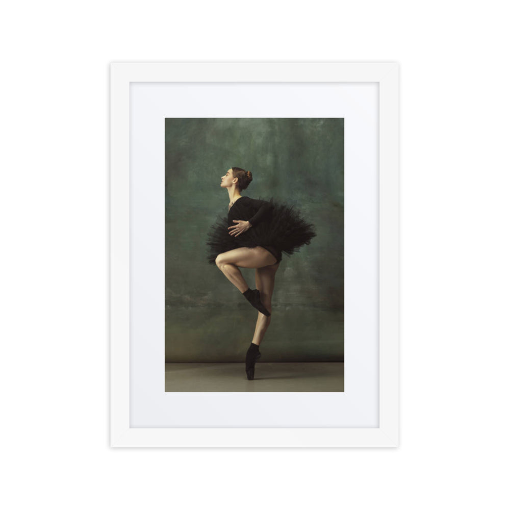 A poised ballerina wearing a black tutu captured mid-pose, embodying grace and precision against a soft green background.