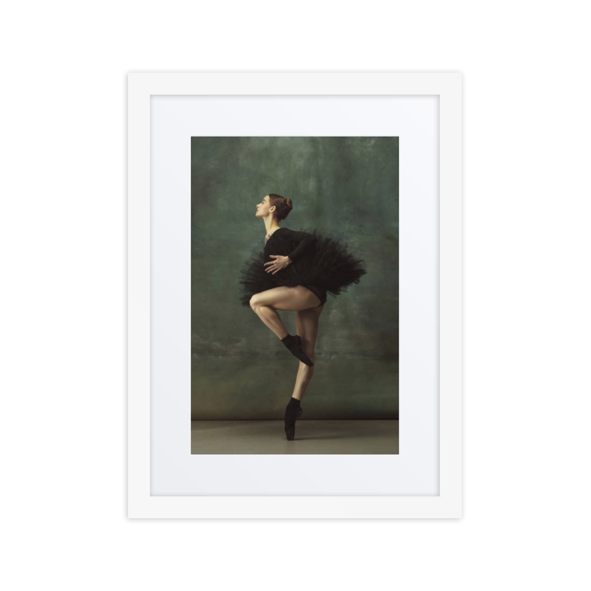 A poised ballerina wearing a black tutu captured mid-pose, embodying grace and precision against a soft green background.