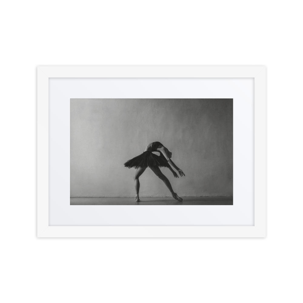 Framed fine art poster titled 'Cambré,' depicting a ballerina performing a deep backbend with an extended arm. Captured in black and white, this striking photograph highlights the fluidity and elegance of classical ballet in a minimalist studio setting.