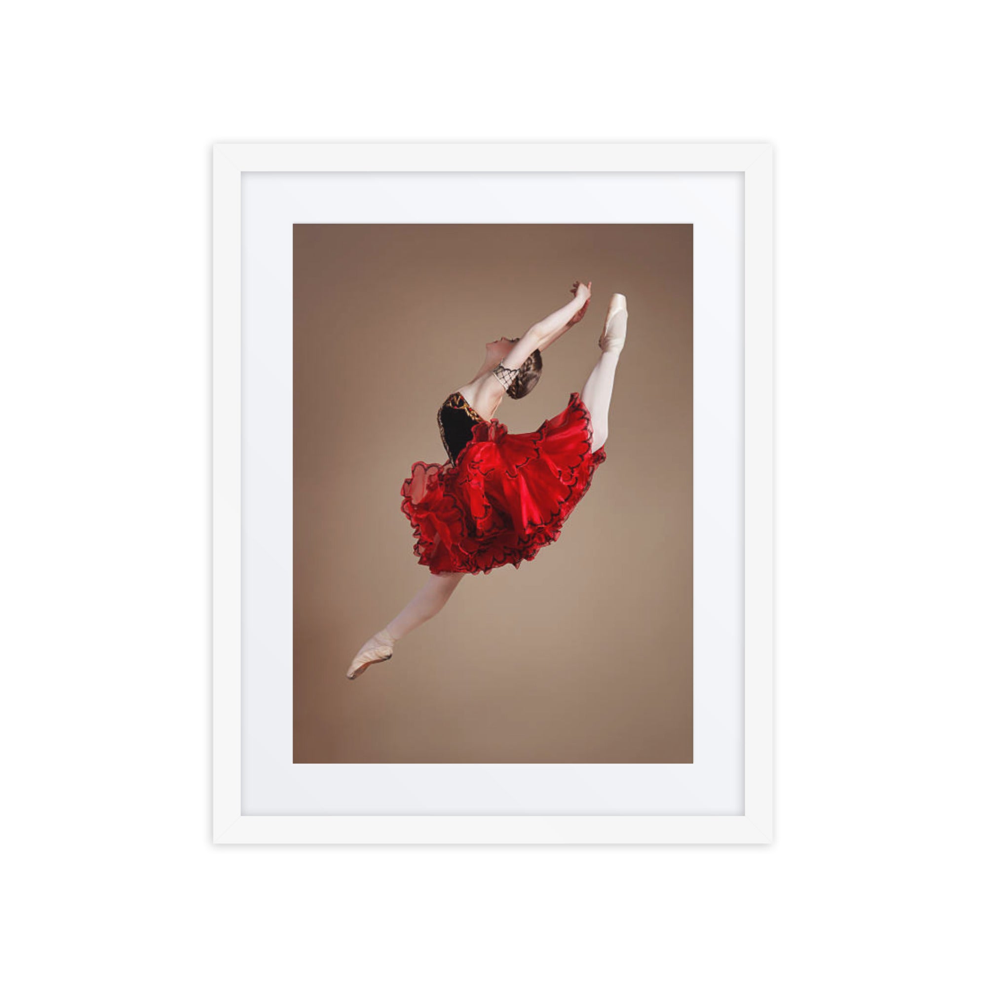 A captivating photograph of a ballerina mid-leap, dressed in a vibrant red tutu with black accents. The dynamic motion and vivid colors highlight the energy and passion of classical ballet.