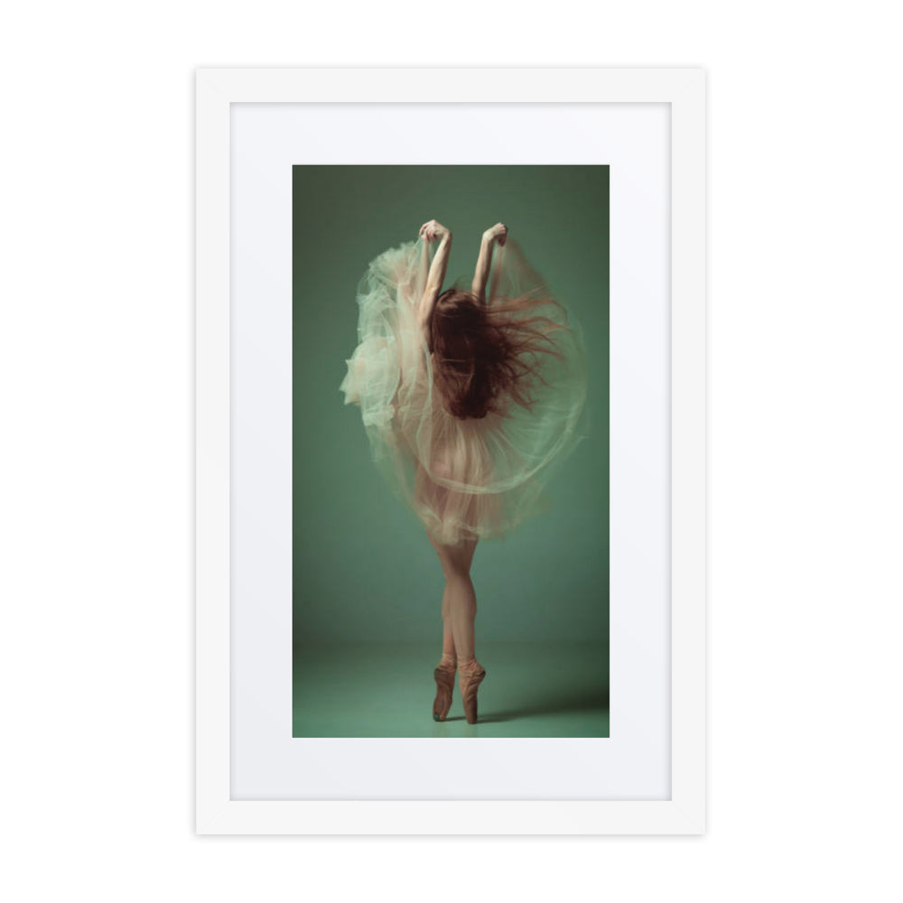 A graceful image of a ballerina en pointe, enveloped in a cascade of flowing fabric, captured in motion against a soft green background.