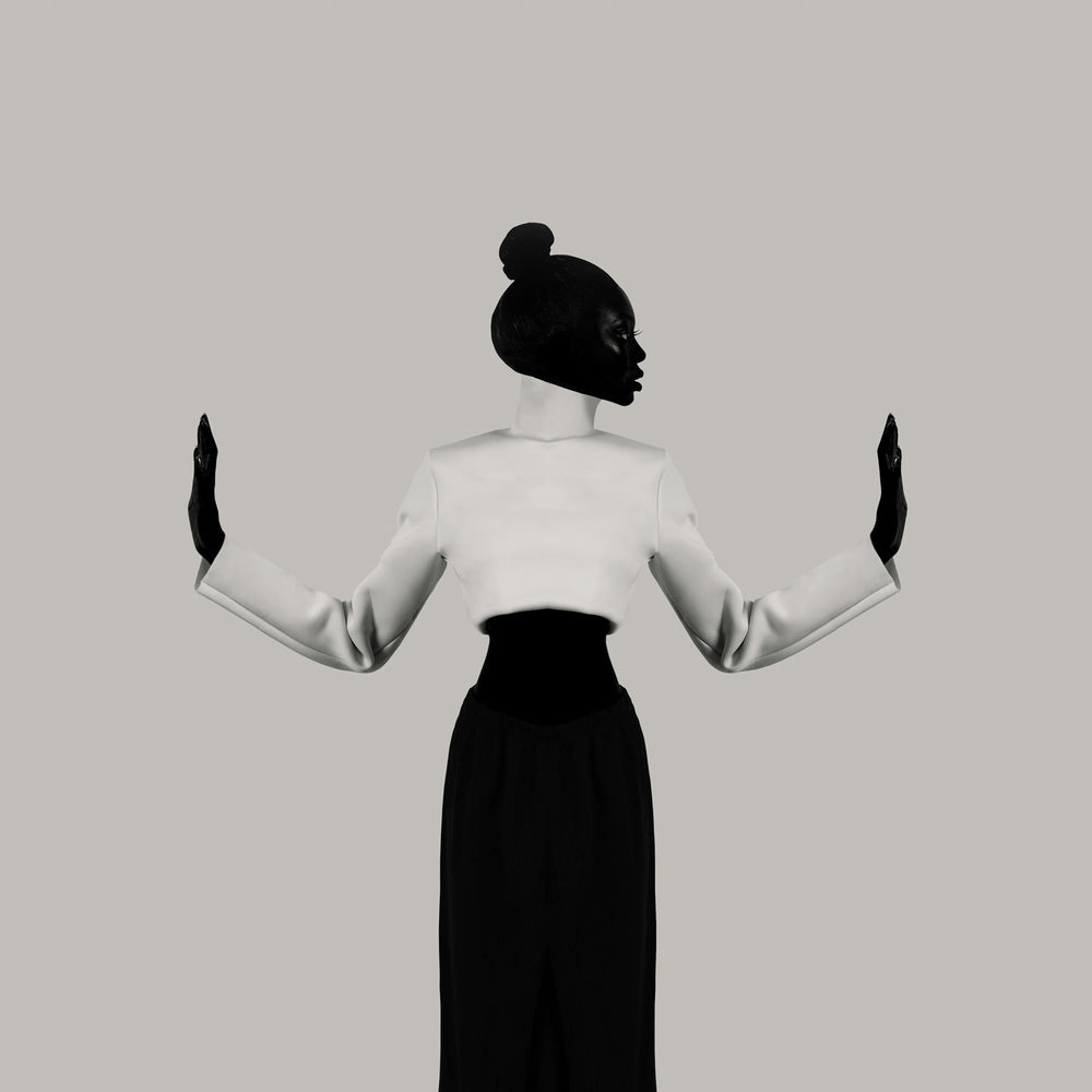 Silhouette of a person wearing a white blouse and black skirt against a plain background