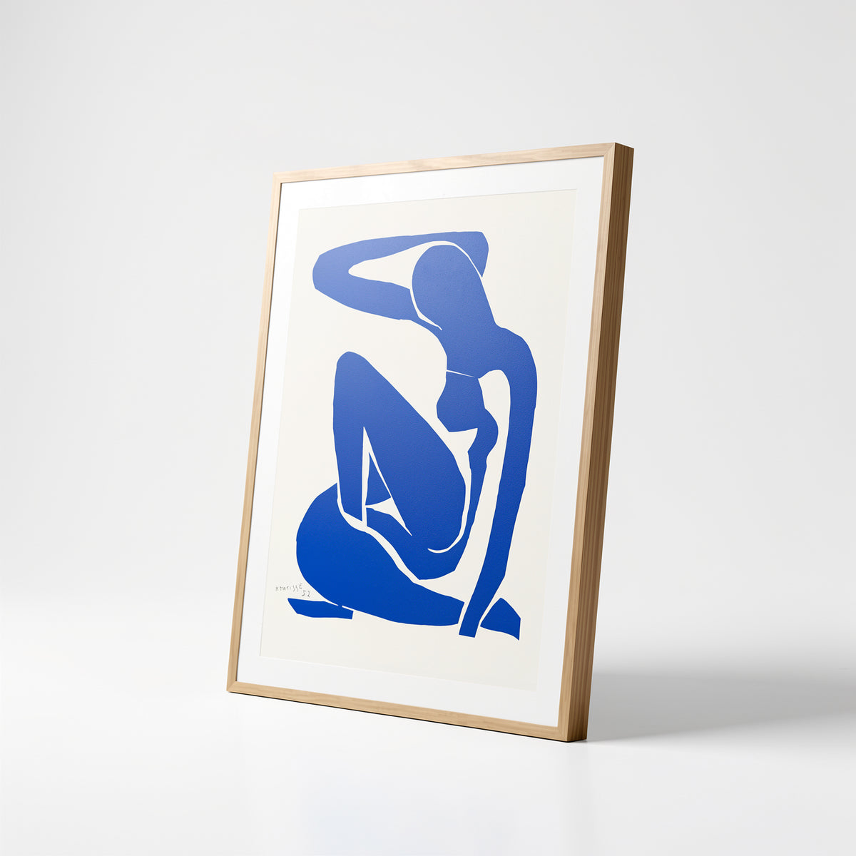 Henri Matisse Nu Bleu I (Blue Nude I), 2007, natural oak frame shown at an angle on a white background.