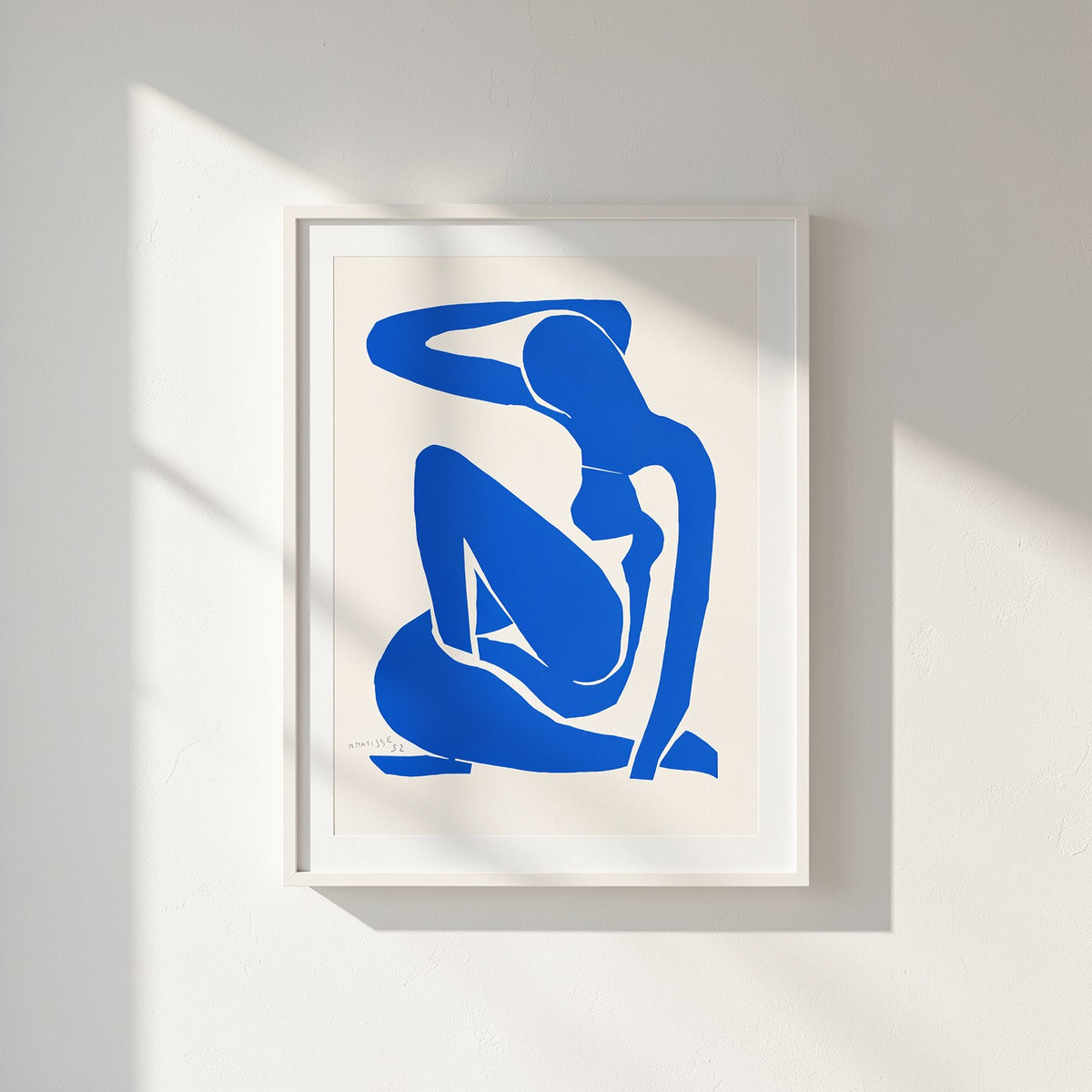 Henri Matisse Nu Bleu I (Blue Nude I), 2007, Soft White framed presentation on a sunlit white wall.