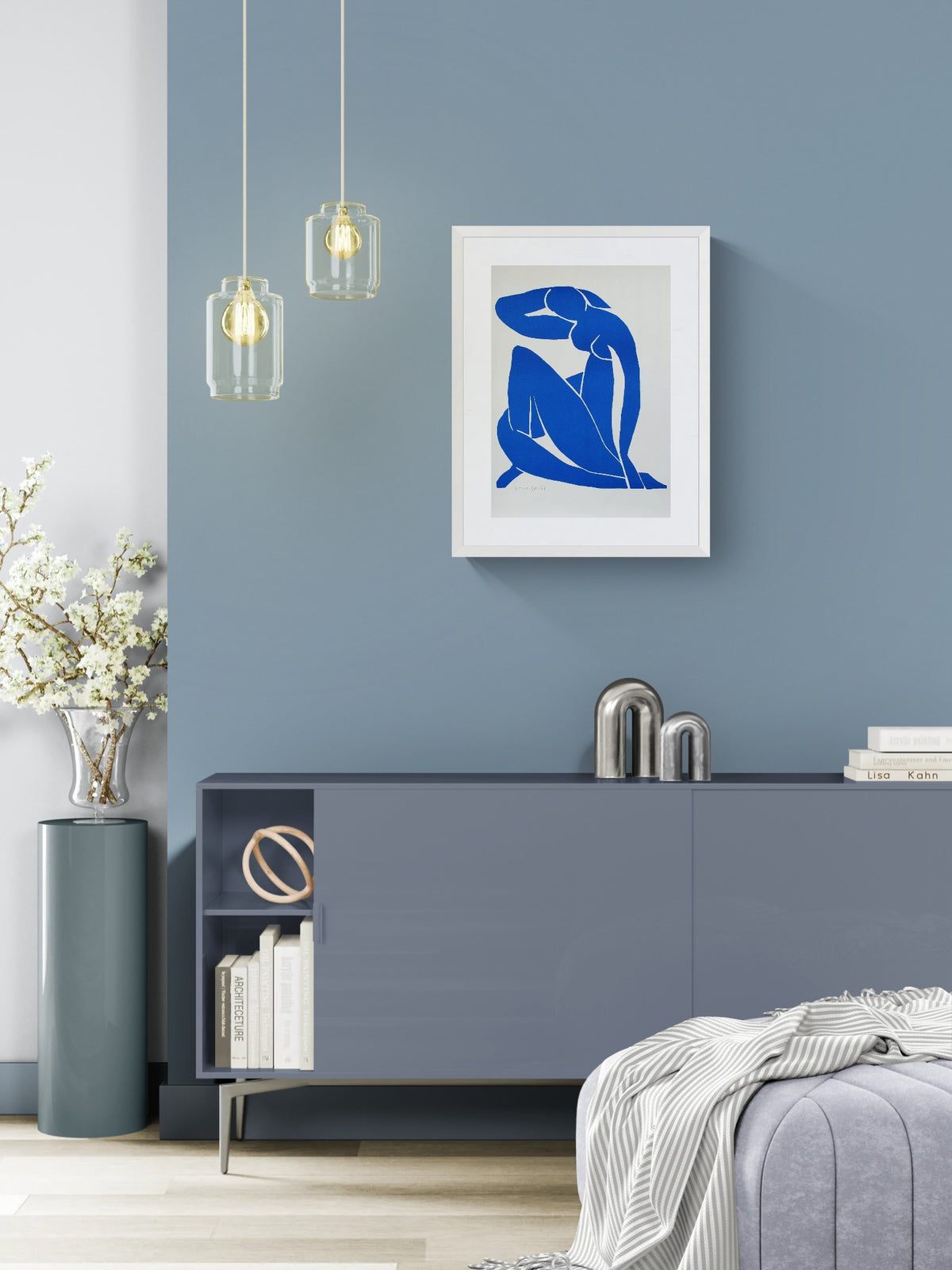 Henri Matisse Nu Bleu II (Blue Nude II), 2007, in a Soft White frame above a cabinet in a bright interior.