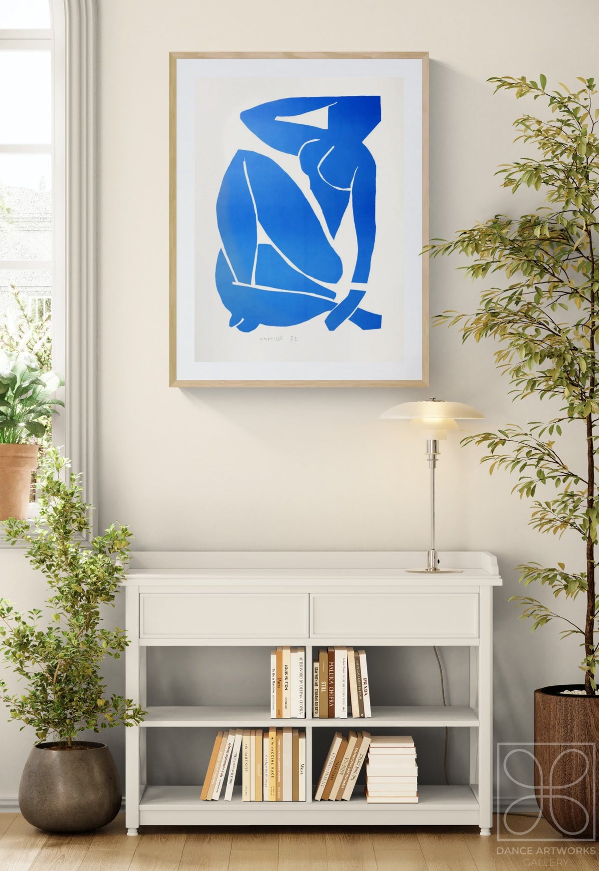 Henri Matisse Nu Bleu III (Blue Nude III), 2007, in a Natural Oak frame above a console in a bright interior.