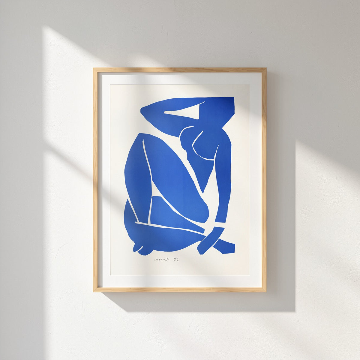 Henri Matisse Nu Bleu III (Blue Nude III), 2007, Natural Oak frame in a sunlit wall close-up.