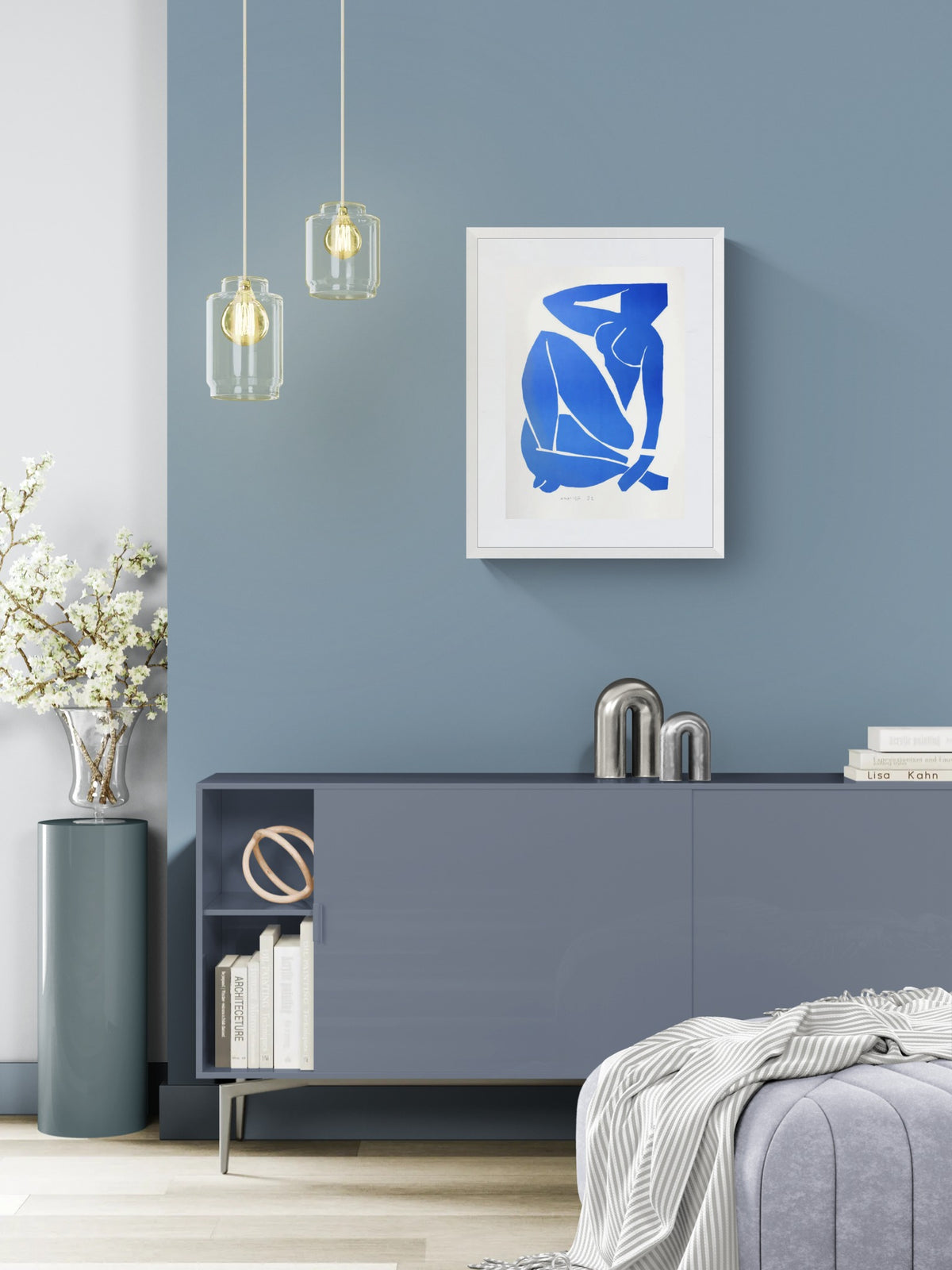 Henri Matisse Nu Bleu III (Blue Nude III), 2007, in a Soft White frame above a cabinet in a bright interior.