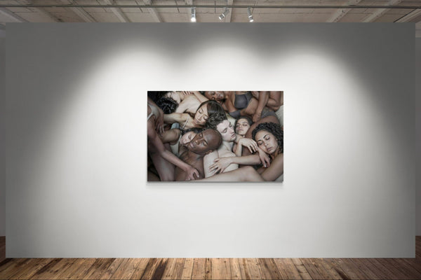 Artistic photograph of a group of people huddled together on a wall in an art gallery.