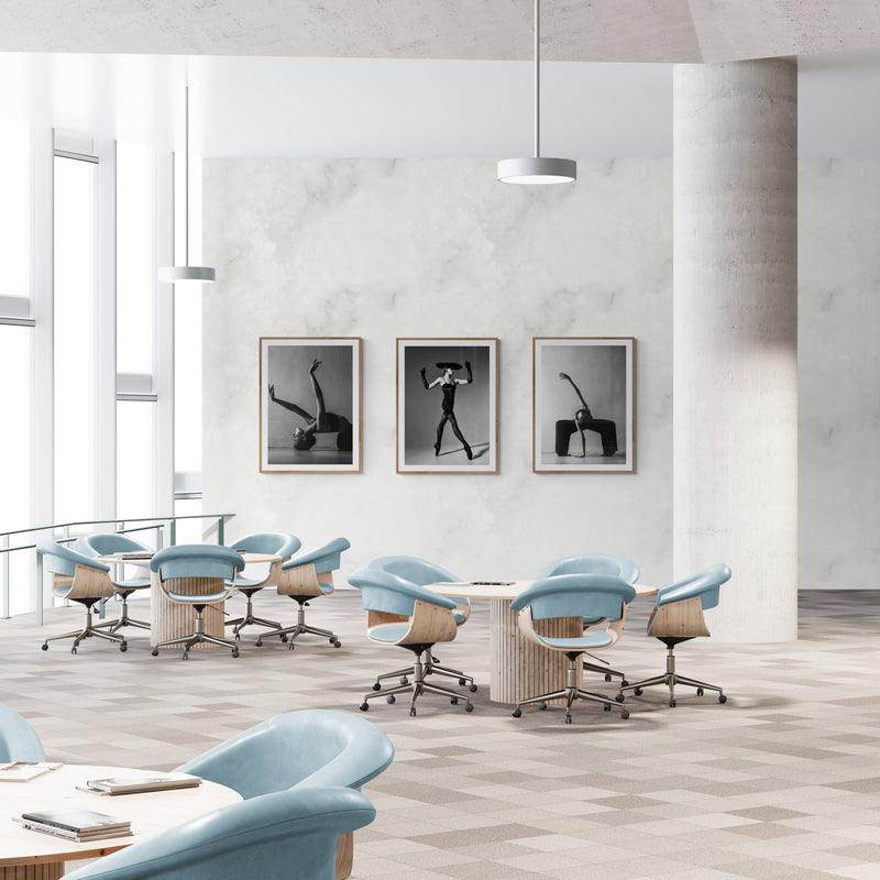 Hospitality lobby interior with dance photography triptych on neutral walls, demonstrating Cloud Dancer color palette for premium commercial spaces