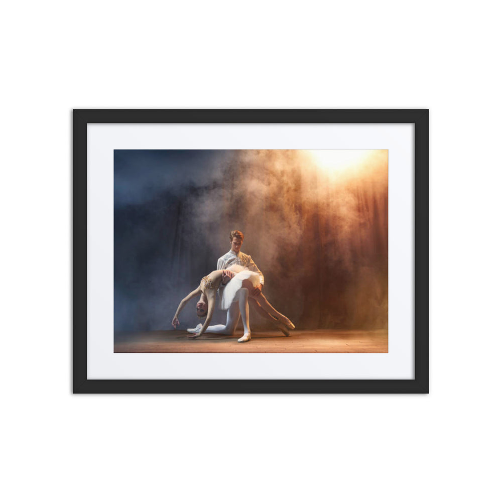 A breathtaking duet performance where two dancers are illuminated by warm and cool lights, creating an ethereal stage atmosphere. The male dancer cradles his partner in a moment of balance and grace.