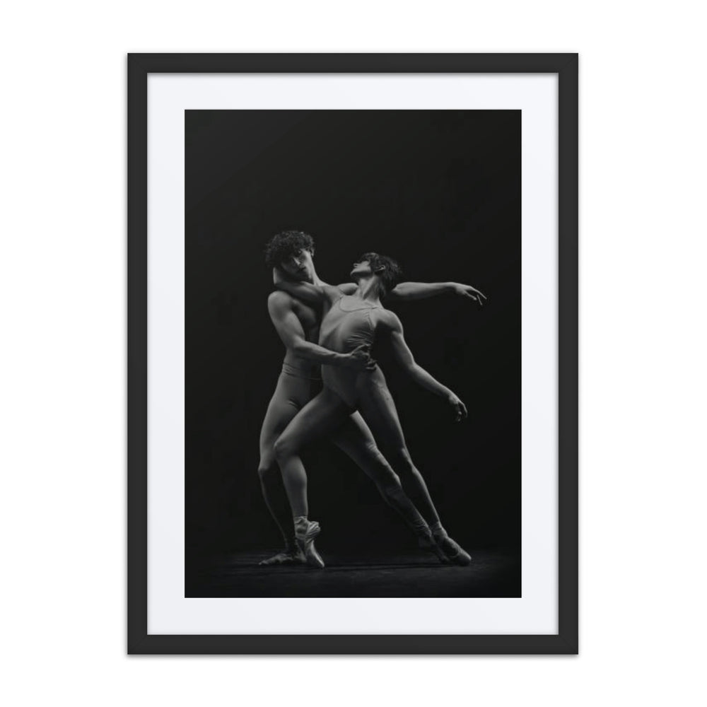 A powerful portrayal of two dancers in an intimate, dynamic pose, expressing the perfect balance of contrast and connection. The dancers’ synchronized movements reflect the duality of strength and grace, captured in monochrome tones that emphasize the raw emotion and elegance of their collaboration.