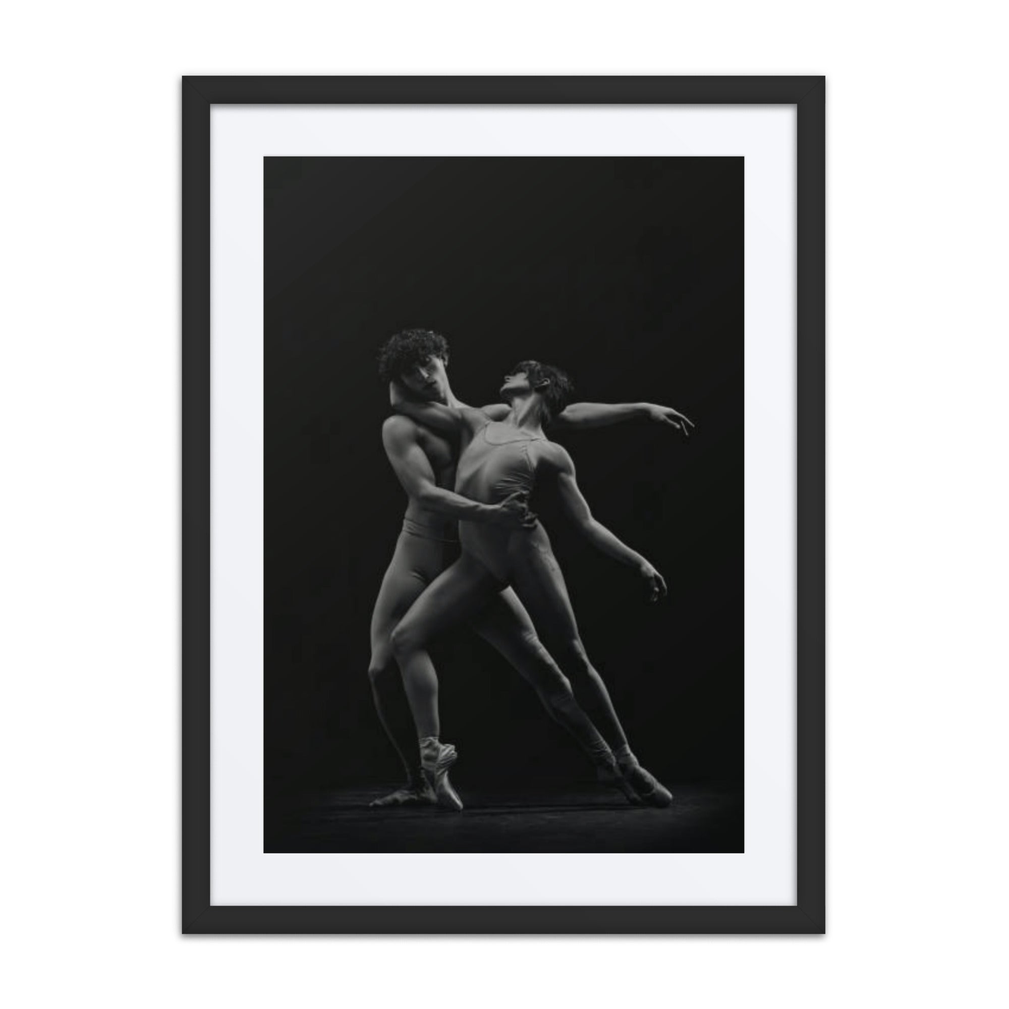 A powerful portrayal of two dancers in an intimate, dynamic pose, expressing the perfect balance of contrast and connection. The dancers’ synchronized movements reflect the duality of strength and grace, captured in monochrome tones that emphasize the raw emotion and elegance of their collaboration.