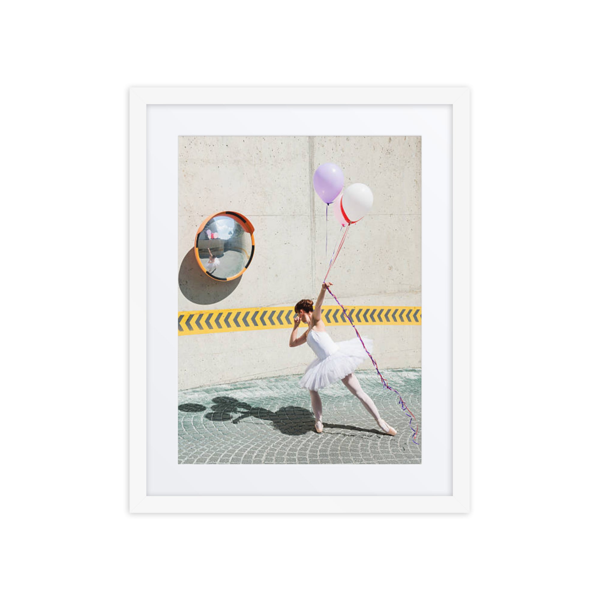 A ballerina's playful moment with balloons, showcasing a blend of lighthearted charm and poised elegance in an urban setting.