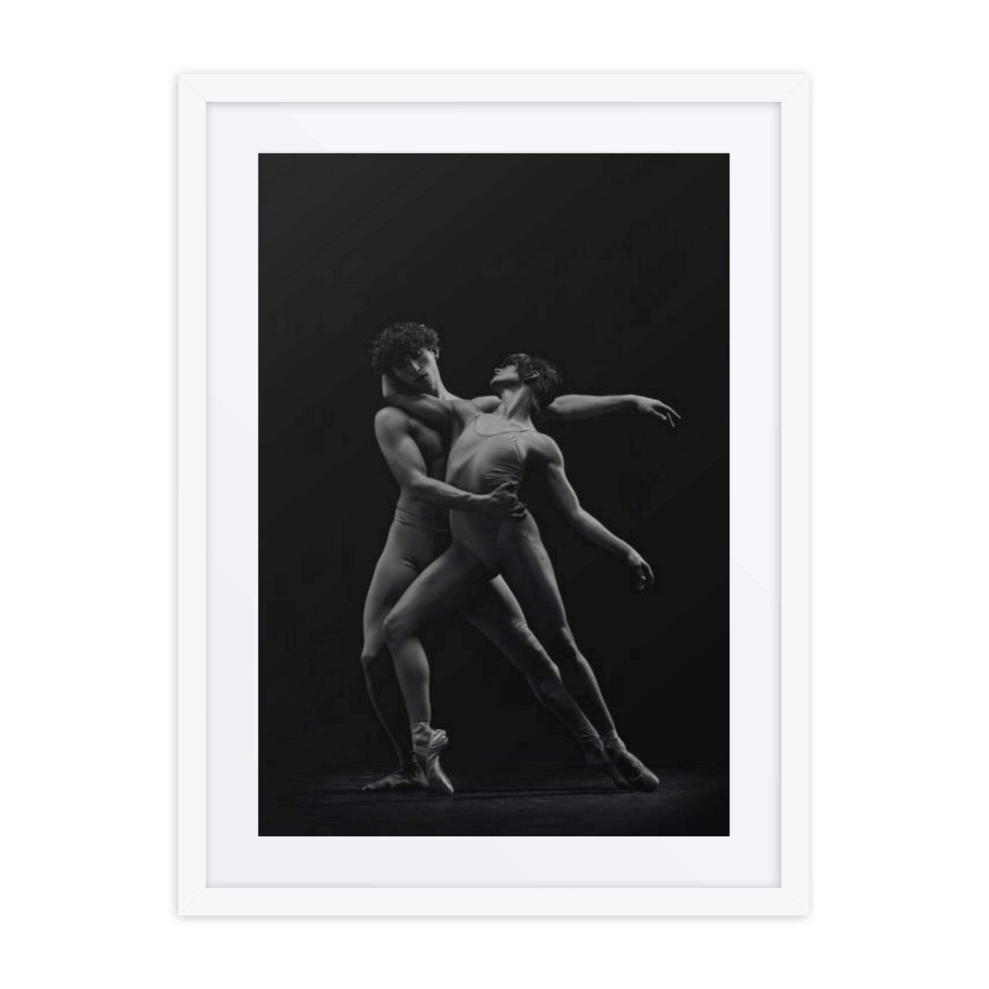 A powerful portrayal of two dancers in an intimate, dynamic pose, expressing the perfect balance of contrast and connection. The dancers’ synchronized movements reflect the duality of strength and grace, captured in monochrome tones that emphasize the raw emotion and elegance of their collaboration.