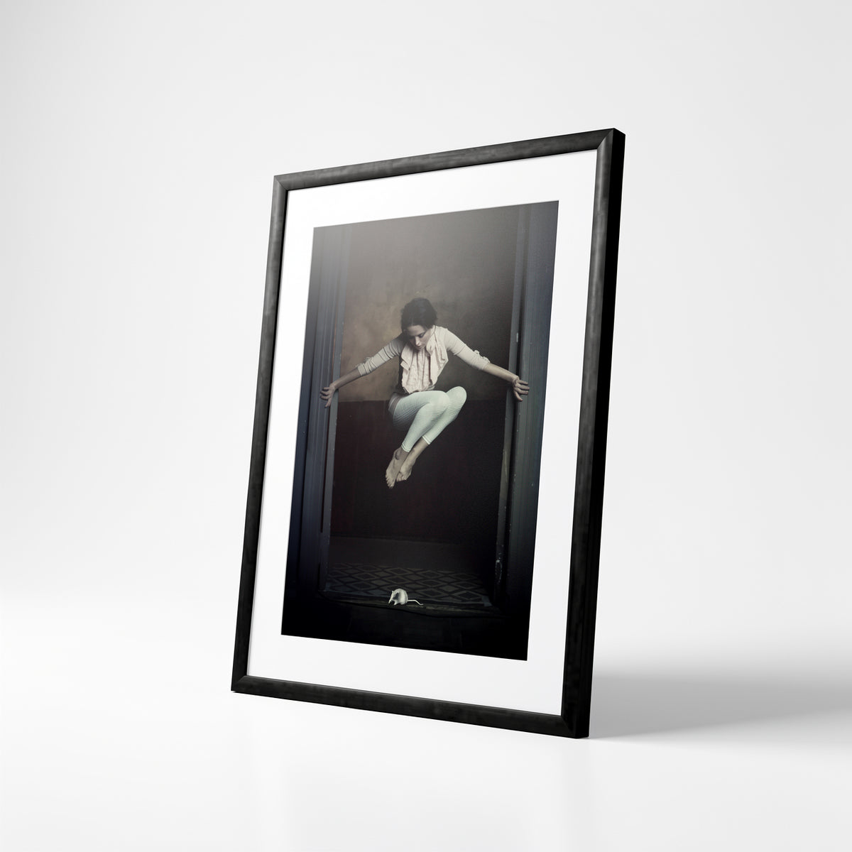 Angled view of Mouse’s Waltz dance print in a black frame
