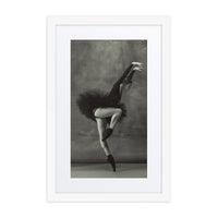 A graceful ballerina in a black tutu, performing a delicate en pointe pose. The black-and-white palette enhances the contrast of motion and stillness in this stunning composition.