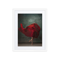 A dynamic composition of a dancer's swirling red dress, capturing the motion and fluidity of movement against a textured green background. The image emphasizes grace, elegance, and bold expression in dance.