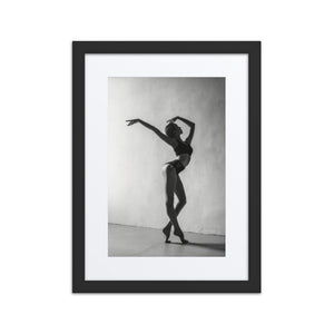 Framed fine art poster titled 'Seductive Still,' showcasing a dancer in an elegant classical ballet pose. The black-and-white imagery captures grace and stillness, creating a striking centerpiece for any space.