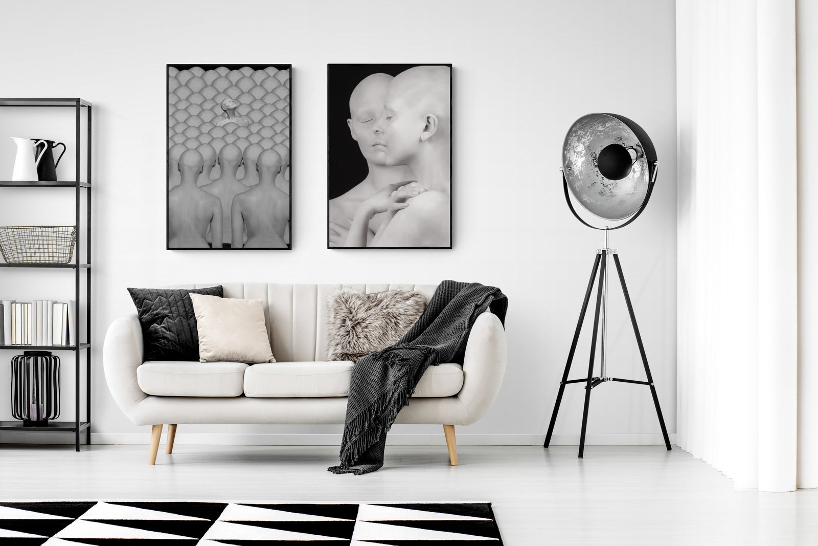 Modern living room with a white sofa, black and white decor, and a stylish floor lamp.