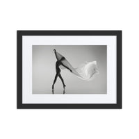 Veil of Grace – A striking fine art dance poster featuring a dancer poised gracefully on pointe, draped in a flowing sheer fabric that creates a veil-like effect. Framed in a sleek black frame with a refined white border, this monochromatic composition evokes movement, elegance, and tranquility, making it a captivating addition to any art collection.