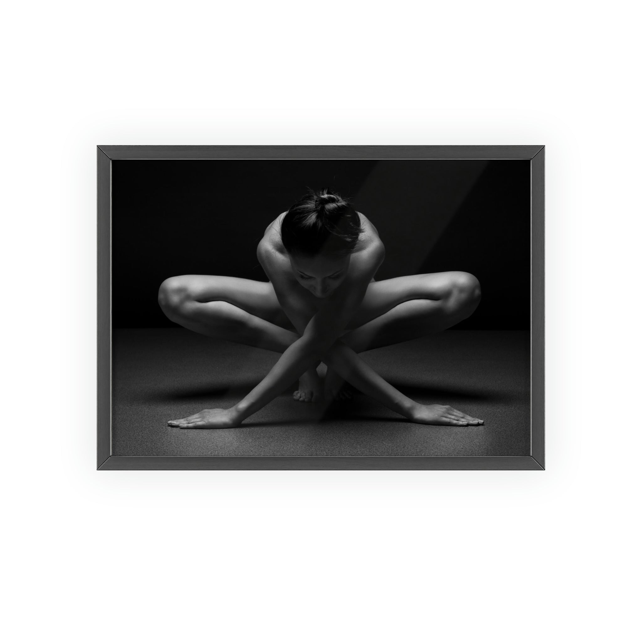 A woman in a yoga pose against a dark grey and black background with wooden frame 4