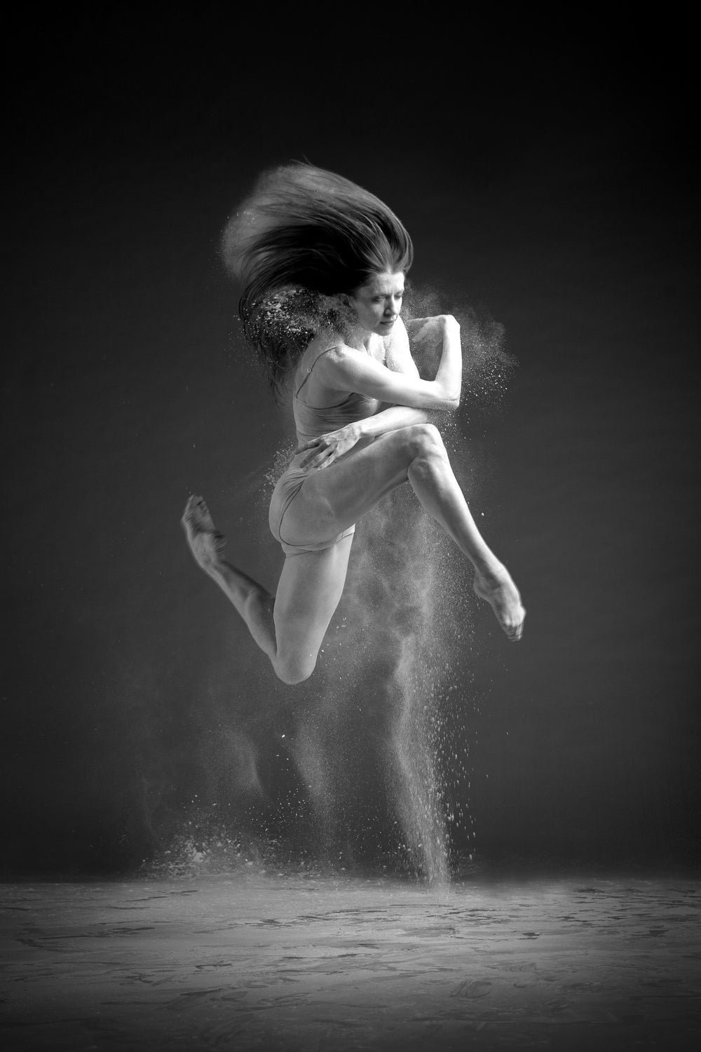 Art Dance Photography Prints - Purchase Online the artwork: Dancer solo in the air jumping and spreading dust from her long hair in a photo in black and white by Francsico Estevez